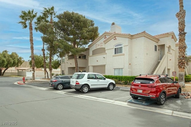 6480 Annie Oakley Dr Unit 511, Las Vegas, NV 89120 - view of building exterior with uncovered parking