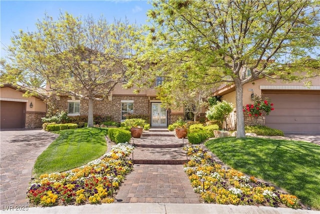 2285 Villefort Ct, Las Vegas, NV 89117 - view of property hidden behind natural elements with stucco siding, french doors, stone siding, and a garage