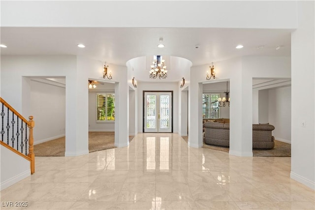 2285 Villefort Ct, Las Vegas, NV 89117 - entrance foyer featuring a chandelier, light marble finish floors, french doors, recessed lighting, and stairs