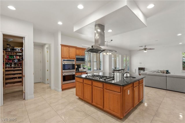 2285 Villefort Ct, Las Vegas, NV 89117 - kitchen featuring appliances with stainless steel finishes, plenty of natural light, island range hood, ceiling fan, and recessed lighting