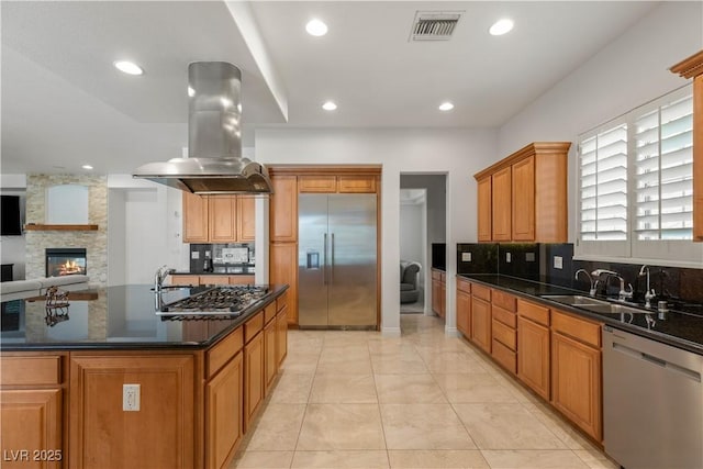 2285 Villefort Ct, Las Vegas, NV 89117 - kitchen with appliances with stainless steel finishes, island range hood, a sink, backsplash, and recessed lighting