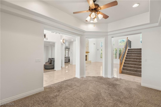 2285 Villefort Ct, Las Vegas, NV 89117 - carpeted empty room featuring stairs, ceiling fan, baseboards, a raised ceiling, and recessed lighting