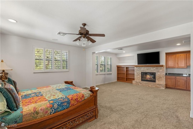 2285 Villefort Ct, Las Vegas, NV 89117 - bedroom with a glass covered fireplace, light colored carpet, recessed lighting, baseboards, and a ceiling fan