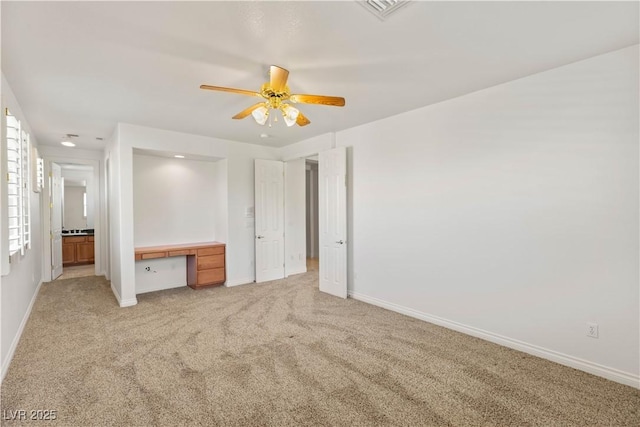 2285 Villefort Ct, Las Vegas, NV 89117 - unfurnished bedroom featuring light colored carpet, baseboards, a ceiling fan, and ensuite bath