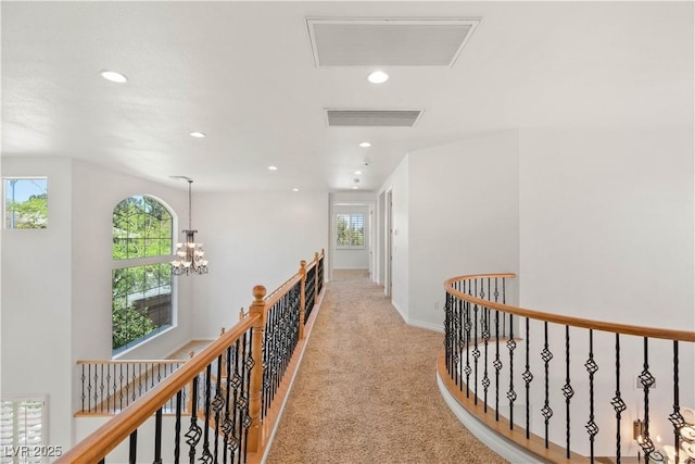 2285 Villefort Ct, Las Vegas, NV 89117 - hallway with an upstairs landing, recessed lighting, light carpet, a chandelier, and baseboards