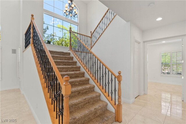 2285 Villefort Ct, Las Vegas, NV 89117 - stairway with a chandelier, baseboards, tile patterned flooring, and recessed lighting