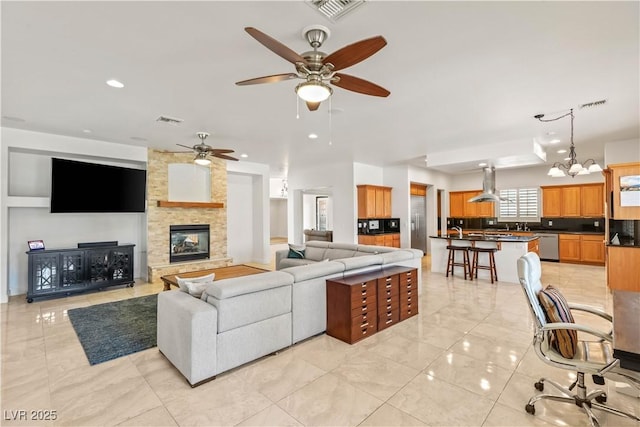 2285 Villefort Ct, Las Vegas, NV 89117 - living room with ceiling fan, a fireplace, recessed lighting, a chandelier, and light marble finish flooring