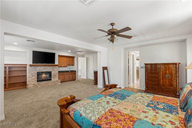 2285 Villefort Ct, Las Vegas, NV 89117 - bedroom featuring light colored carpet, a fireplace, recessed lighting, and a ceiling fan