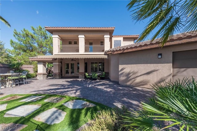 2285 Villefort Ct, Las Vegas, NV 89117 - back of property featuring a balcony, stucco siding, french doors, and a patio