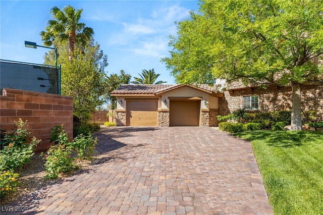 2285 Villefort Ct, Las Vegas, NV 89117 - view of front of property featuring stone siding, an attached garage, decorative driveway, stucco siding, and a tiled roof