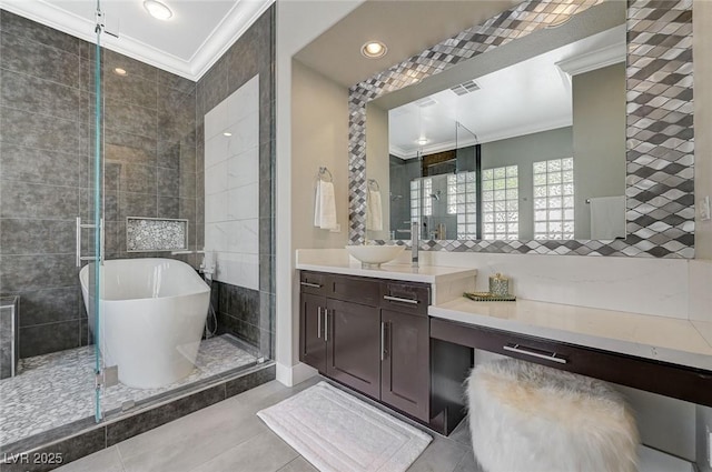 bathroom featuring vanity, a soaking tub, recessed lighting, tile patterned flooring, and crown molding