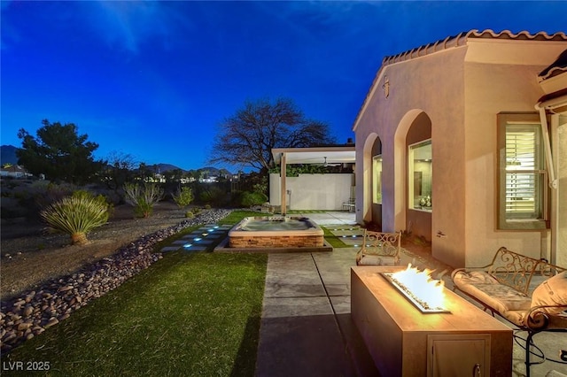 view of patio / terrace with a fire pit
