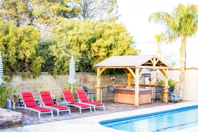 view of swimming pool featuring a fenced in pool, a gazebo, a patio area, and fence