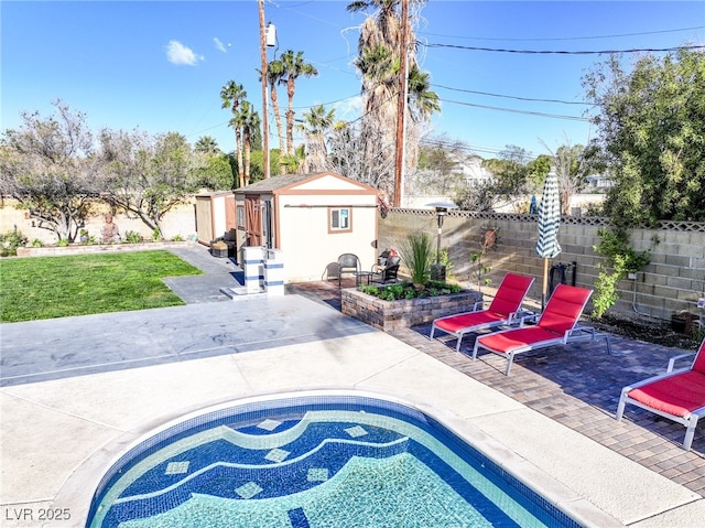 view of patio featuring a fenced backyard, an outbuilding, and a fenced in pool