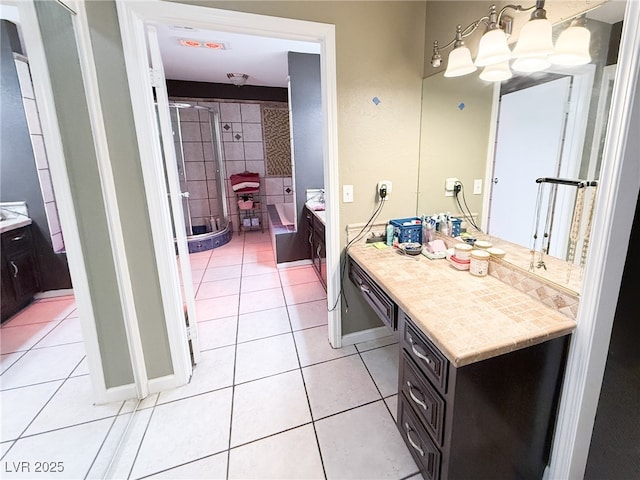 bathroom featuring a shower stall, a chandelier, a bath, vanity, and tile patterned flooring