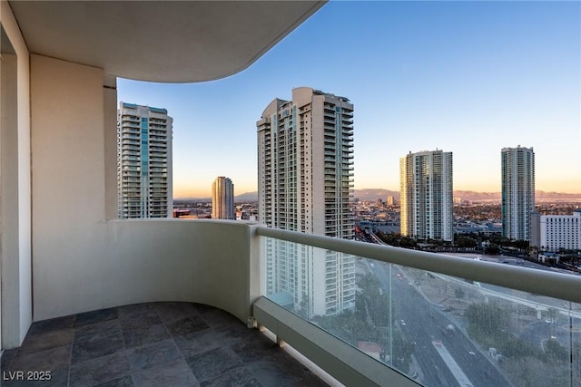 balcony at dusk with a city view