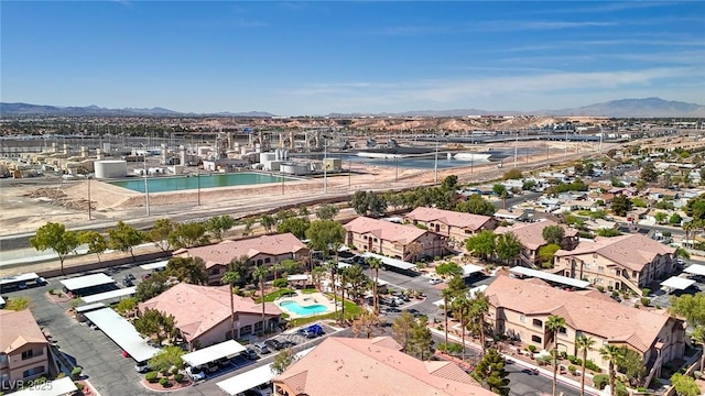 birds eye view of property with a mountain view and a residential view