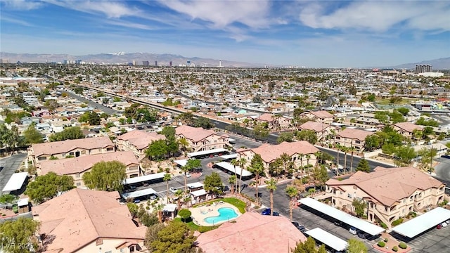 drone / aerial view featuring a residential view and a mountain view