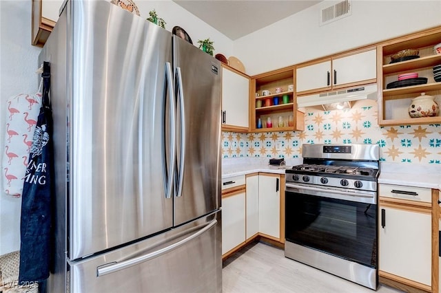 kitchen with light countertops, open shelves, appliances with stainless steel finishes, and under cabinet range hood