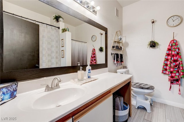 full bathroom with vanity, toilet, baseboards, and visible vents