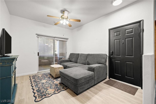 5751 Hacienda Ave Unit 135, Las Vegas, NV 89122 - living room featuring a ceiling fan and wood finished floors