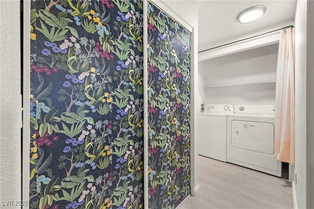 5751 Hacienda Ave Unit 135, Las Vegas, NV 89122 - bathroom featuring independent washer and dryer and wood finished floors