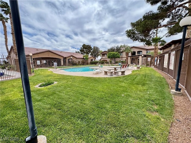 5751 Hacienda Ave Unit 135, Las Vegas, NV 89122 - view of yard featuring a patio area and a community pool