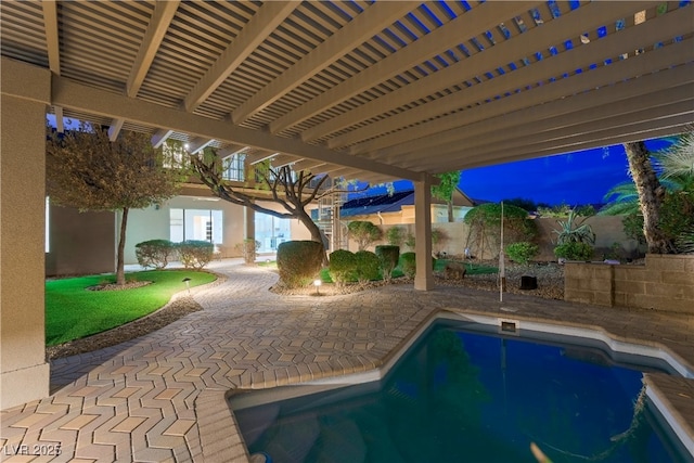 view of swimming pool featuring a patio, a fenced in pool, and a fenced backyard
