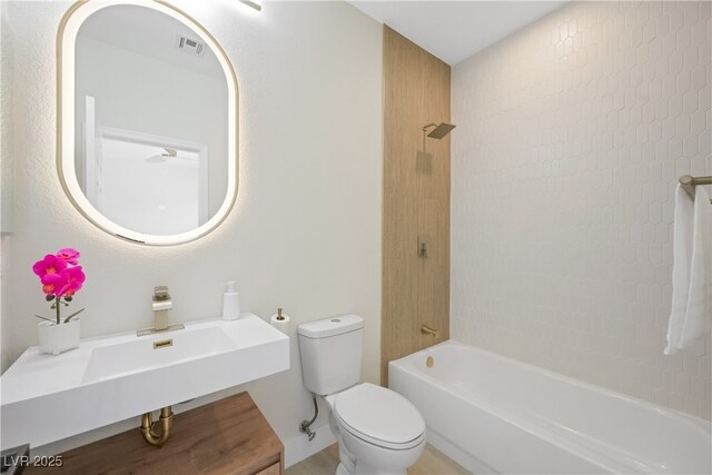 full bath featuring toilet, visible vents, and shower / bathing tub combination
