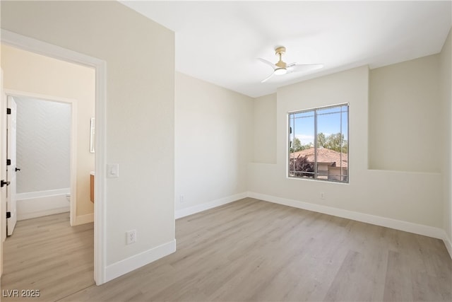 unfurnished room with light wood-type flooring, baseboards, and ceiling fan