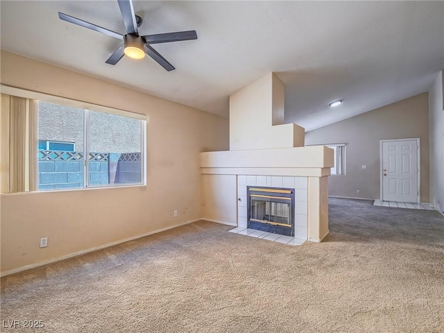 218 Pretty Sunset Ter, Henderson, NV 89015 - unfurnished living room with a fireplace, carpet, a ceiling fan, vaulted ceiling, and baseboards