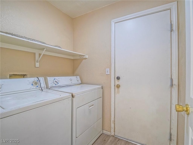 218 Pretty Sunset Ter, Henderson, NV 89015 - clothes washing area with washer and dryer, laundry area, and light wood finished floors