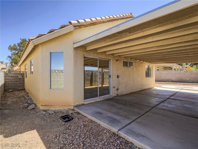 218 Pretty Sunset Ter, Henderson, NV 89015 - back of property featuring a fenced backyard, a patio, and stucco siding