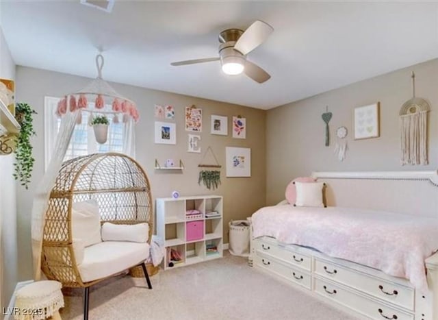 bedroom featuring carpet flooring, a ceiling fan, and visible vents
