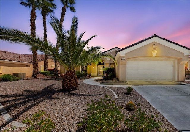 3016 High Range Dr, Las Vegas, NV 89134 - view of front of house featuring stucco siding, driveway, a garage, and a tiled roof