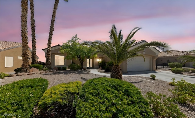 3016 High Range Dr, Las Vegas, NV 89134 - view of front of home featuring concrete driveway, stucco siding, and an attached garage