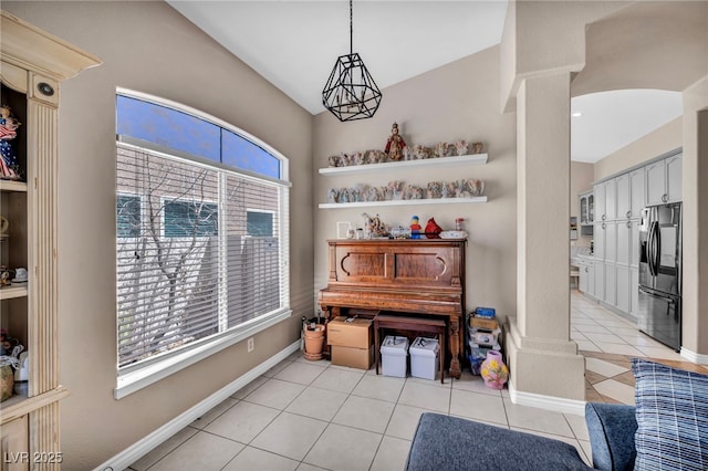 90 Ancient Hills Ln, Henderson, NV 89074 - living area with decorative columns, light tile patterned floors, and baseboards