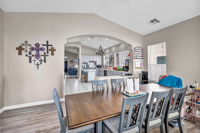 90 Ancient Hills Ln, Henderson, NV 89074 - dining room with arched walkways, a chandelier, light wood-type flooring, baseboards, and recessed lighting