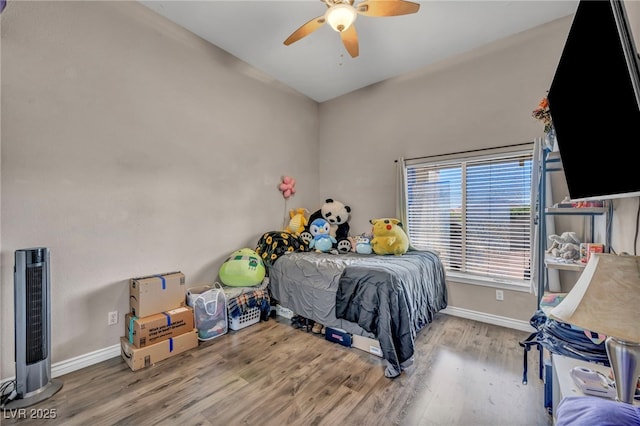 90 Ancient Hills Ln, Henderson, NV 89074 - bedroom featuring baseboards, wood finished floors, and a ceiling fan