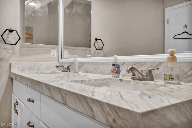 90 Ancient Hills Ln, Henderson, NV 89074 - full bath featuring tasteful backsplash, double vanity, and a textured wall