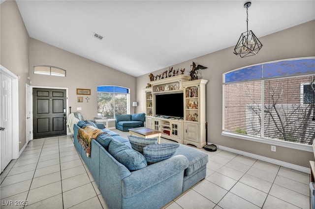 90 Ancient Hills Ln, Henderson, NV 89074 - living area featuring light tile patterned flooring, baseboards, and high vaulted ceiling