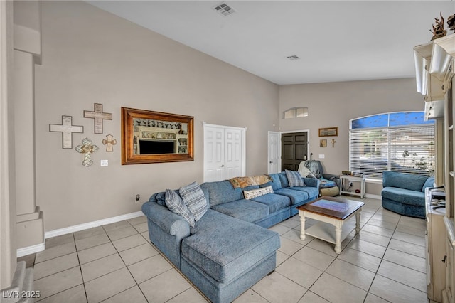 90 Ancient Hills Ln, Henderson, NV 89074 - living room with light tile patterned flooring, baseboards, and high vaulted ceiling