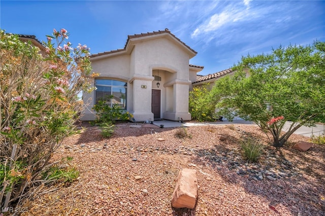90 Ancient Hills Ln, Henderson, NV 89074 - mediterranean / spanish-style home featuring a tiled roof and stucco siding