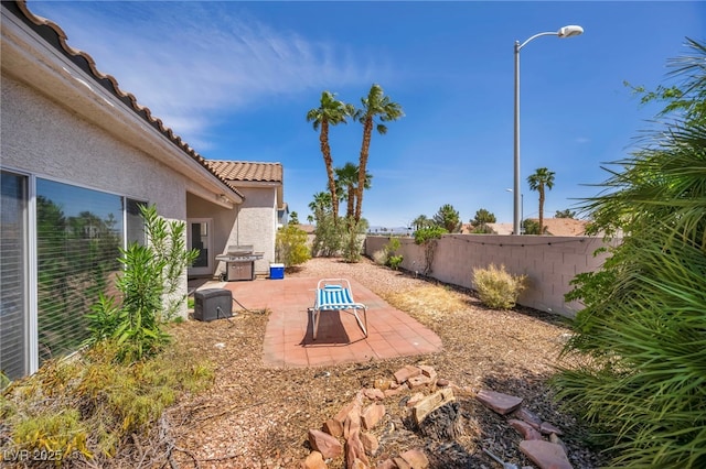 90 Ancient Hills Ln, Henderson, NV 89074 - fenced backyard with a patio area
