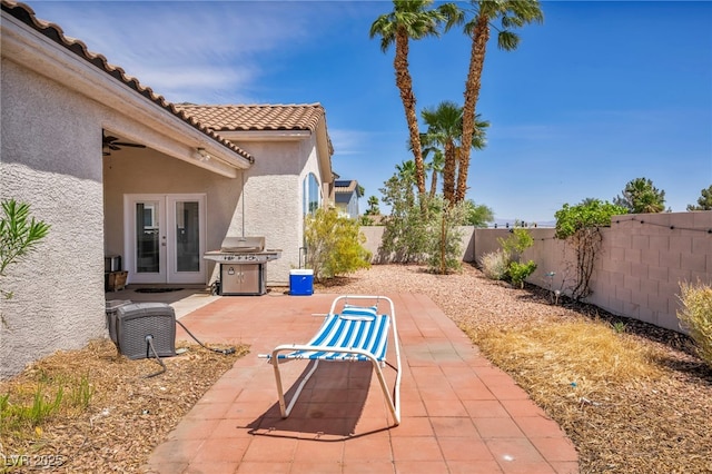 90 Ancient Hills Ln, Henderson, NV 89074 - view of patio featuring grilling area, french doors, and a fenced backyard