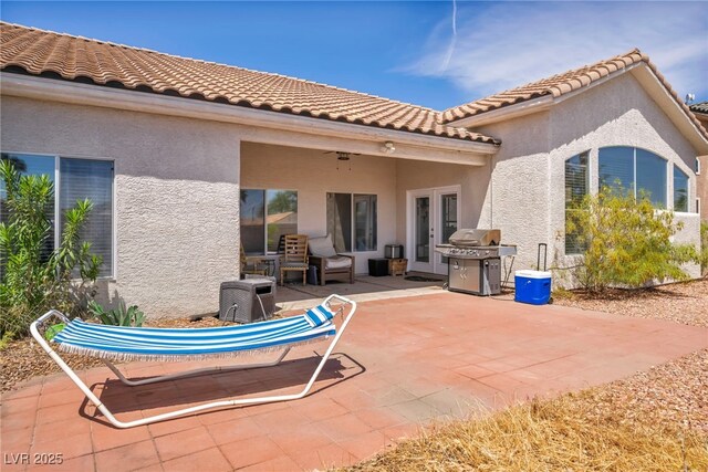 90 Ancient Hills Ln, Henderson, NV 89074 - back of house featuring a patio, stucco siding, and a tile roof