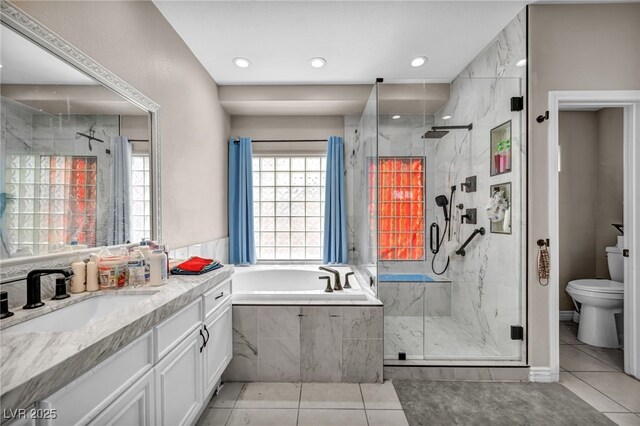 90 Ancient Hills Ln, Henderson, NV 89074 - bathroom with tile patterned flooring, a marble finish shower, a bath, vanity, and toilet