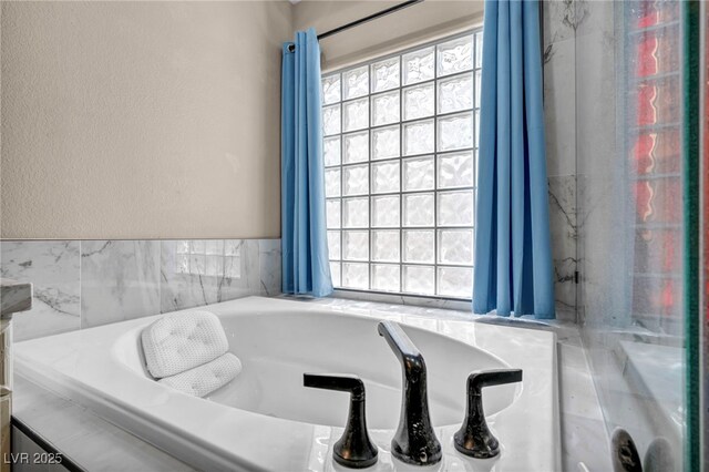90 Ancient Hills Ln, Henderson, NV 89074 - bathroom with healthy amount of natural light and a tub
