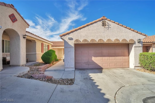9383 Borough Park St, Las Vegas, NV 89178 - mediterranean / spanish-style house featuring a tiled roof, an attached garage, driveway, and stucco siding