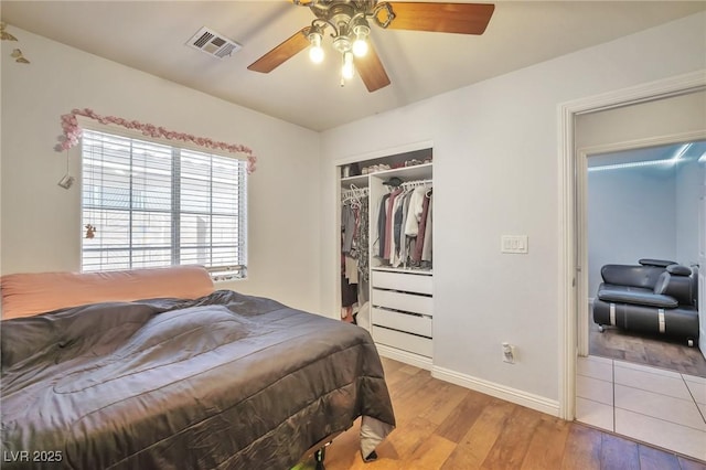 9383 Borough Park St, Las Vegas, NV 89178 - bedroom featuring light wood-style floors, a closet, a ceiling fan, visible vents, and baseboards